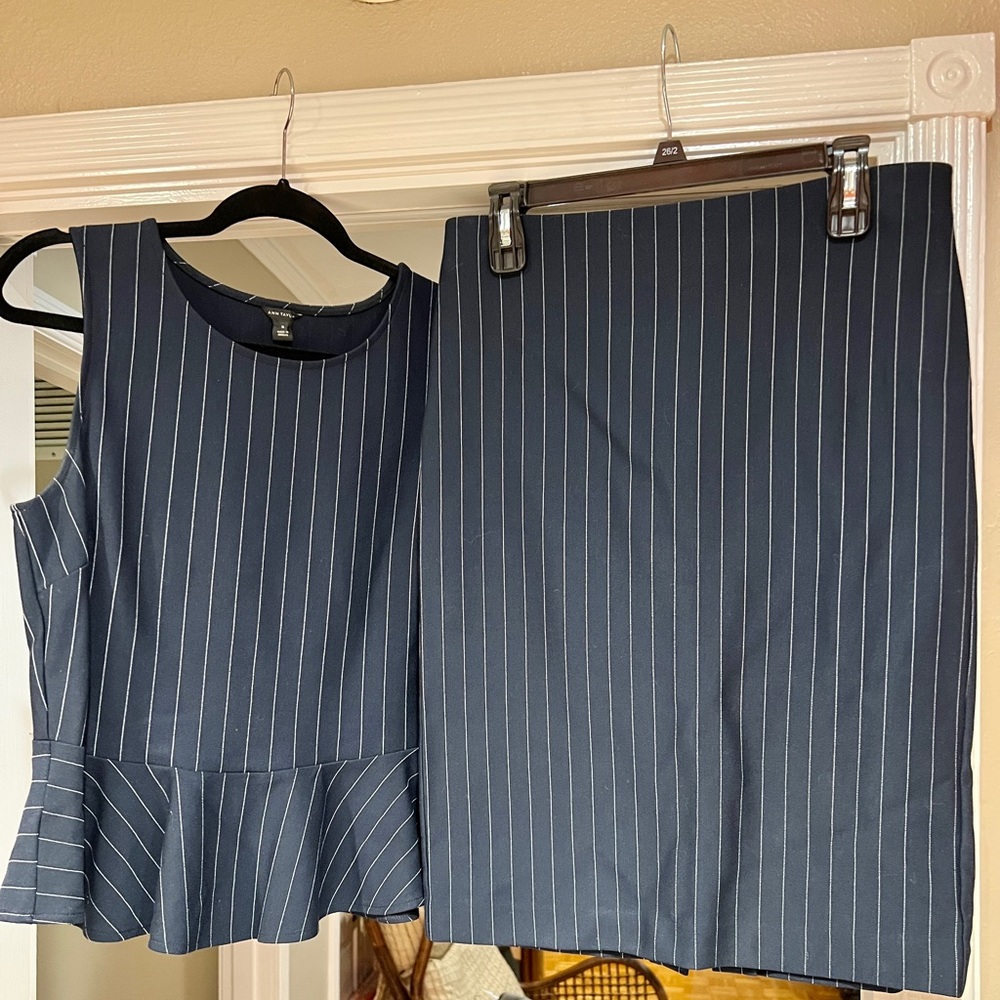 Ladies Navy Blue and white peplum and skirt pen stripe two piece set.